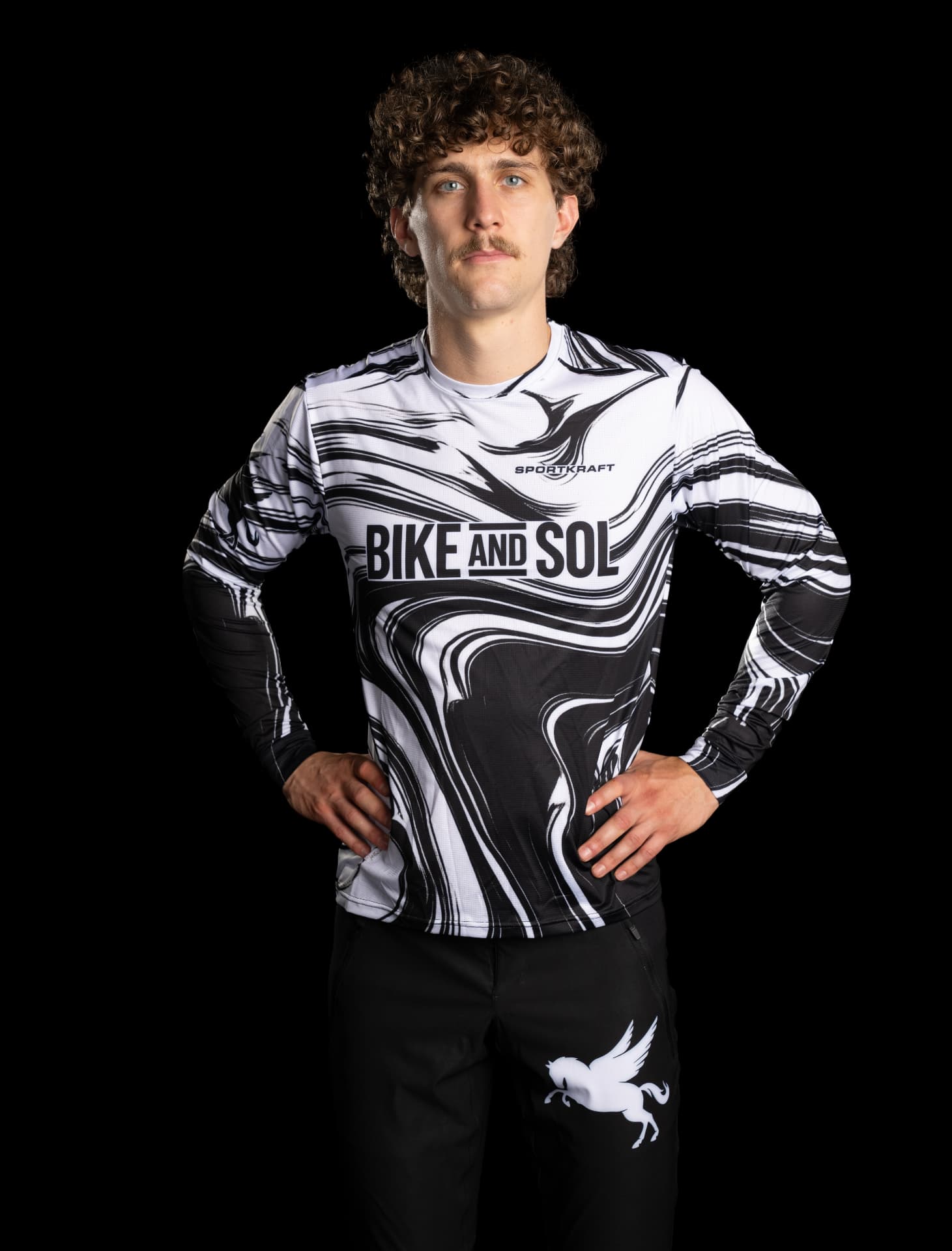 Rider in the SPORTKRAFT Core 1.1 MTB Jersey in a black and white marbled Bike and Sol design