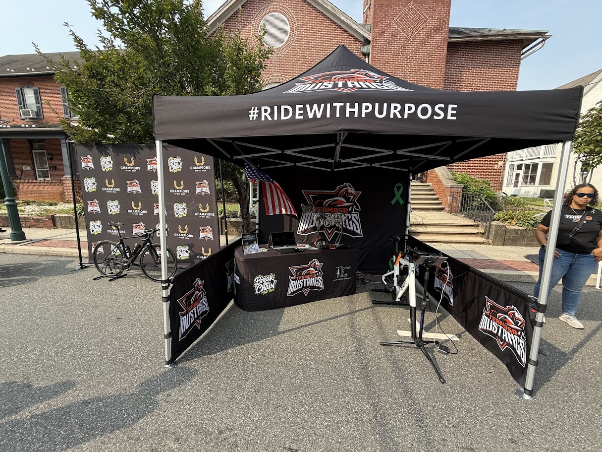 Branded team canopy tent with banners and table cover