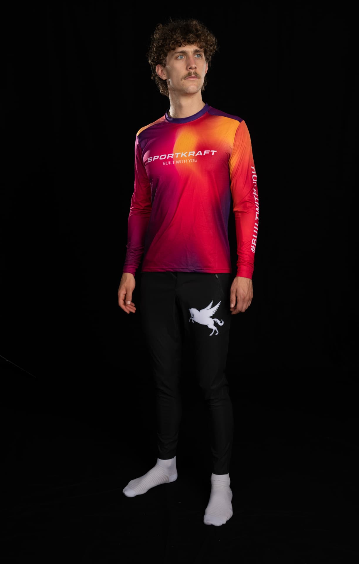 Rider in black SPORTKRAFT Core 1.1 MTB Pants with a white Pegasus mark