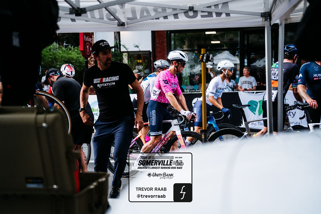 Rider in a custom pink Sportkraft kit rolling to the start line at the Tour of Somerville