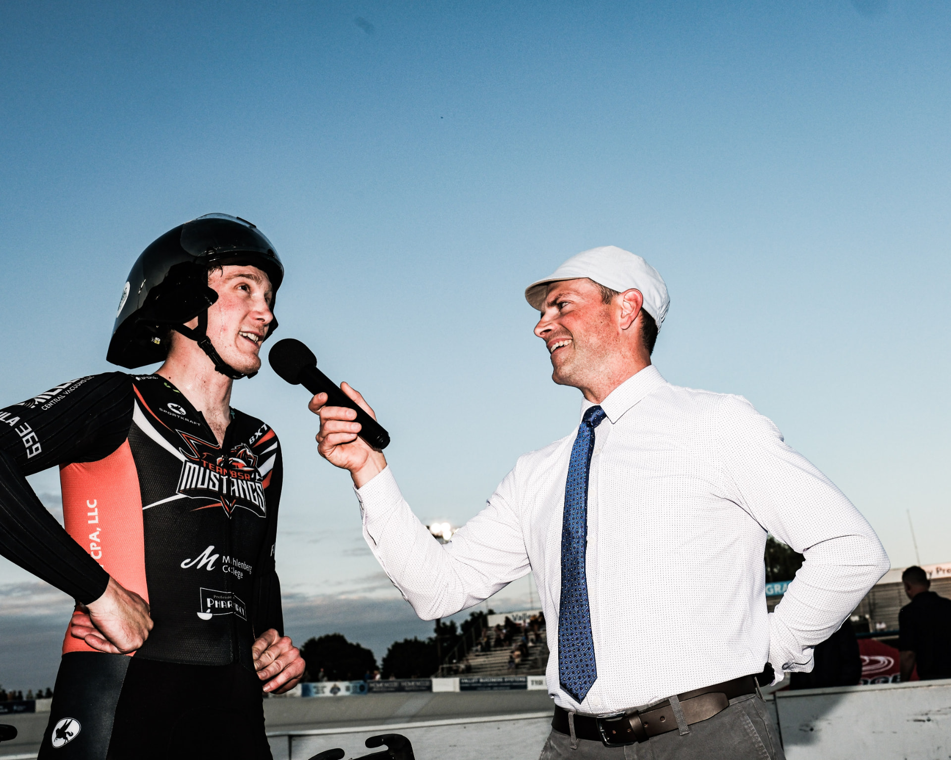 Track athlete in custom Sportkraft skinsuit being interviewed after a race